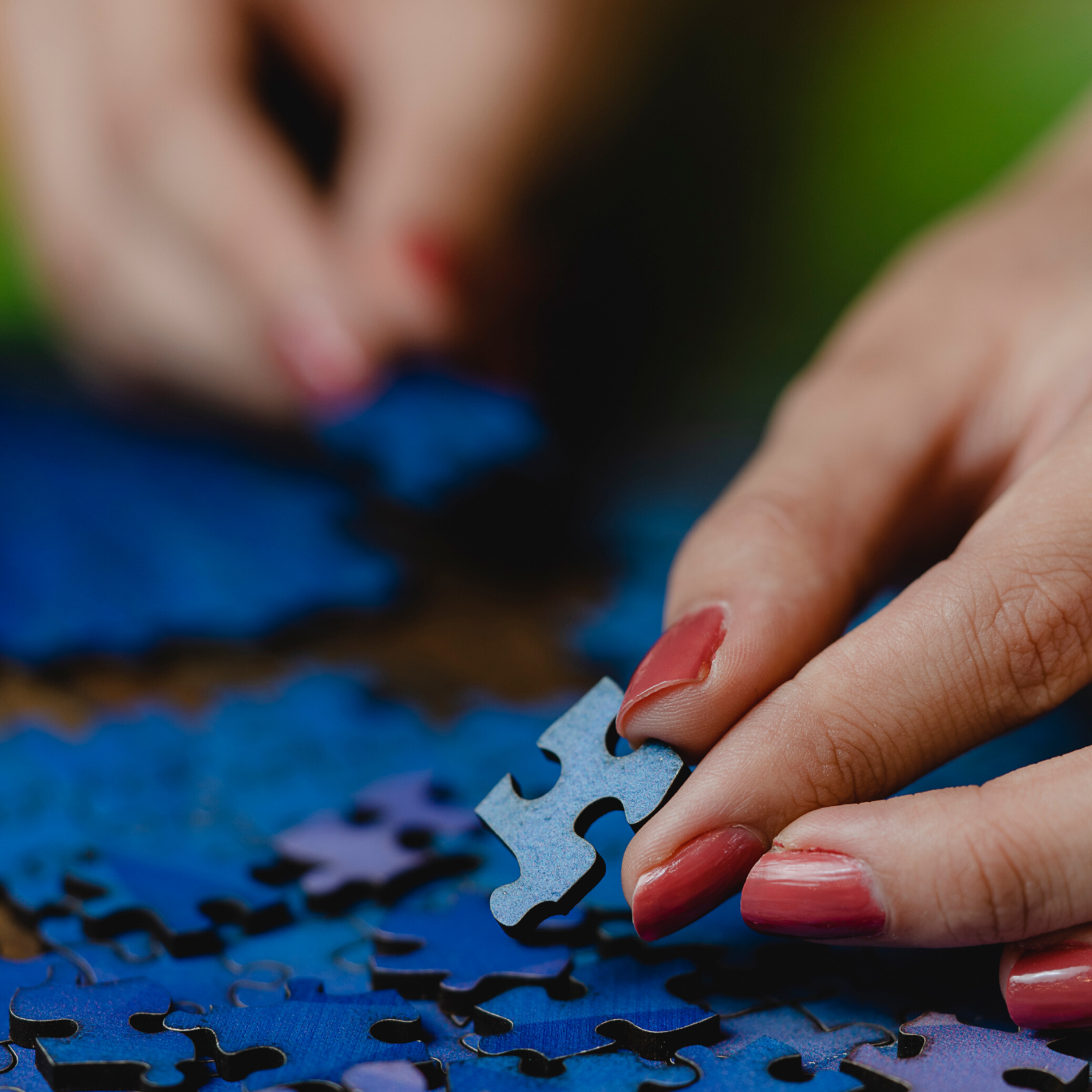 hands holding jigsaw pieces