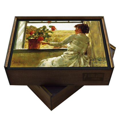 Handcrafted wooden puzzle featuring a painting by Childe Hassam. Impressionist scene of a woman at a window with geraniums overlooking a golden field.  Peaceful, sunlit, rural landscape. Collectible art puzzle.