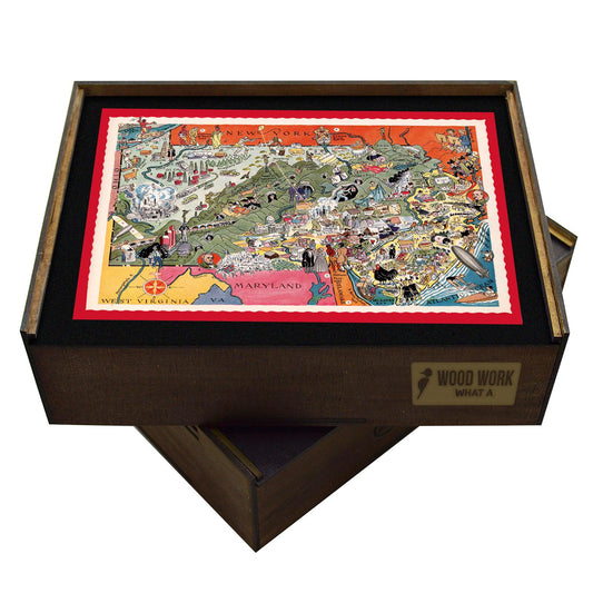 Handcrafted wooden jigsaw puzzle featuring a colorful vintage map of Pennsylvania and New Jersey with illustrations of cities, rivers, and mountains.